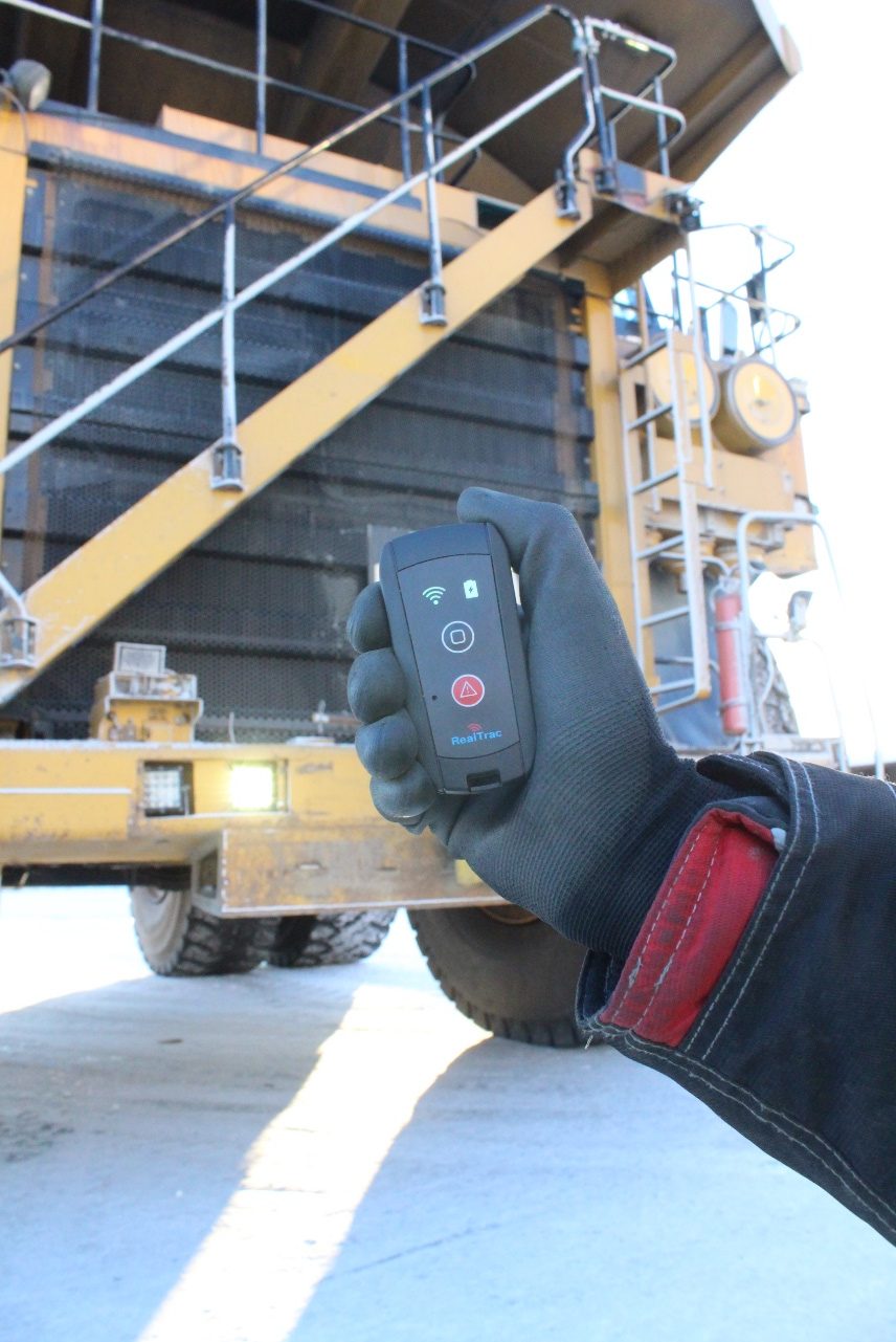 RealTrac personal tag in a worker's hand
