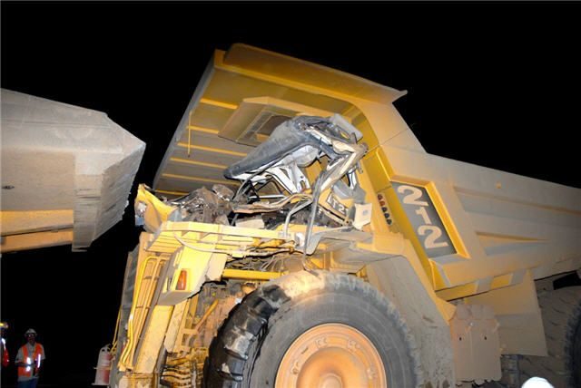Damaged cab of a haul truck after a collision